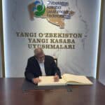 Jeff signing a guestbook in Uzbekistan