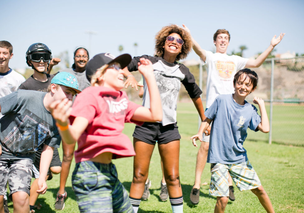 Campers and counselors jumping for the camera